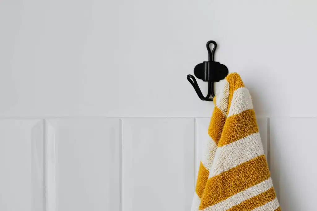 Musty towel hanging in bathroom after washing